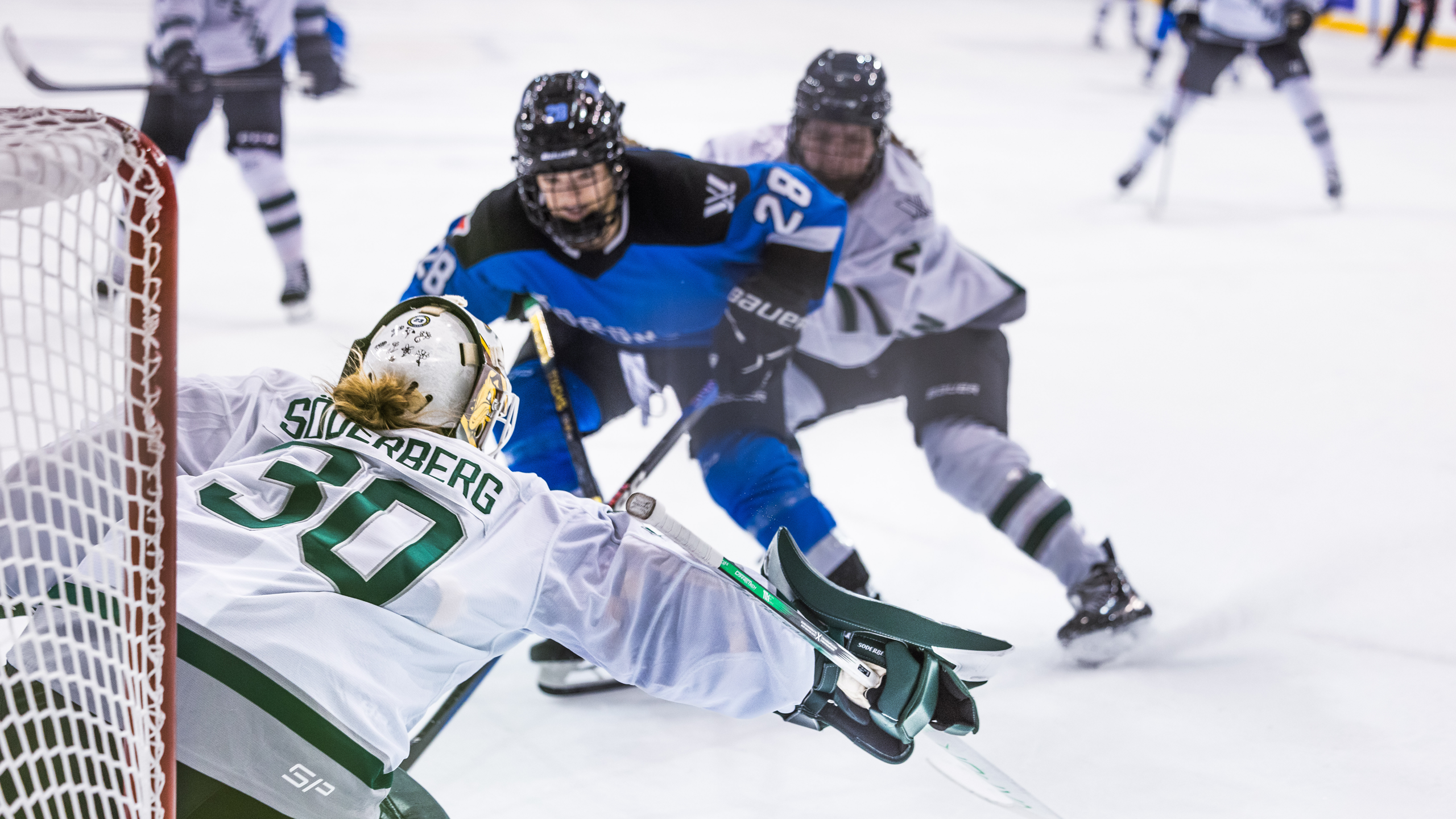 A PWHL Toronto player skates towards PWHL Boston goalie Emma Söderberg