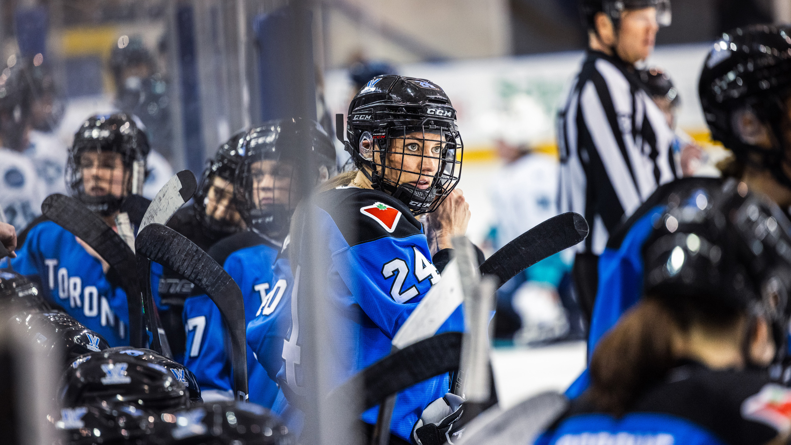 PWHL Toronto player Natalie Spooner stares at the ice from the bench