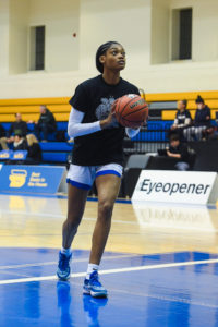 TMU women's basketball player Lauren Meek warmups wearing the Black History Month-designed shirt