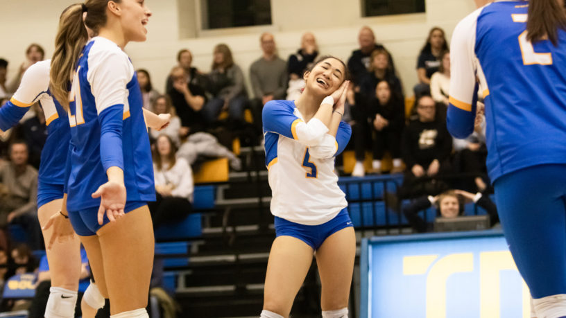 TMU Bold women's volleyball player Mary Rioflorido motions to a "to sleep" sign with her hands