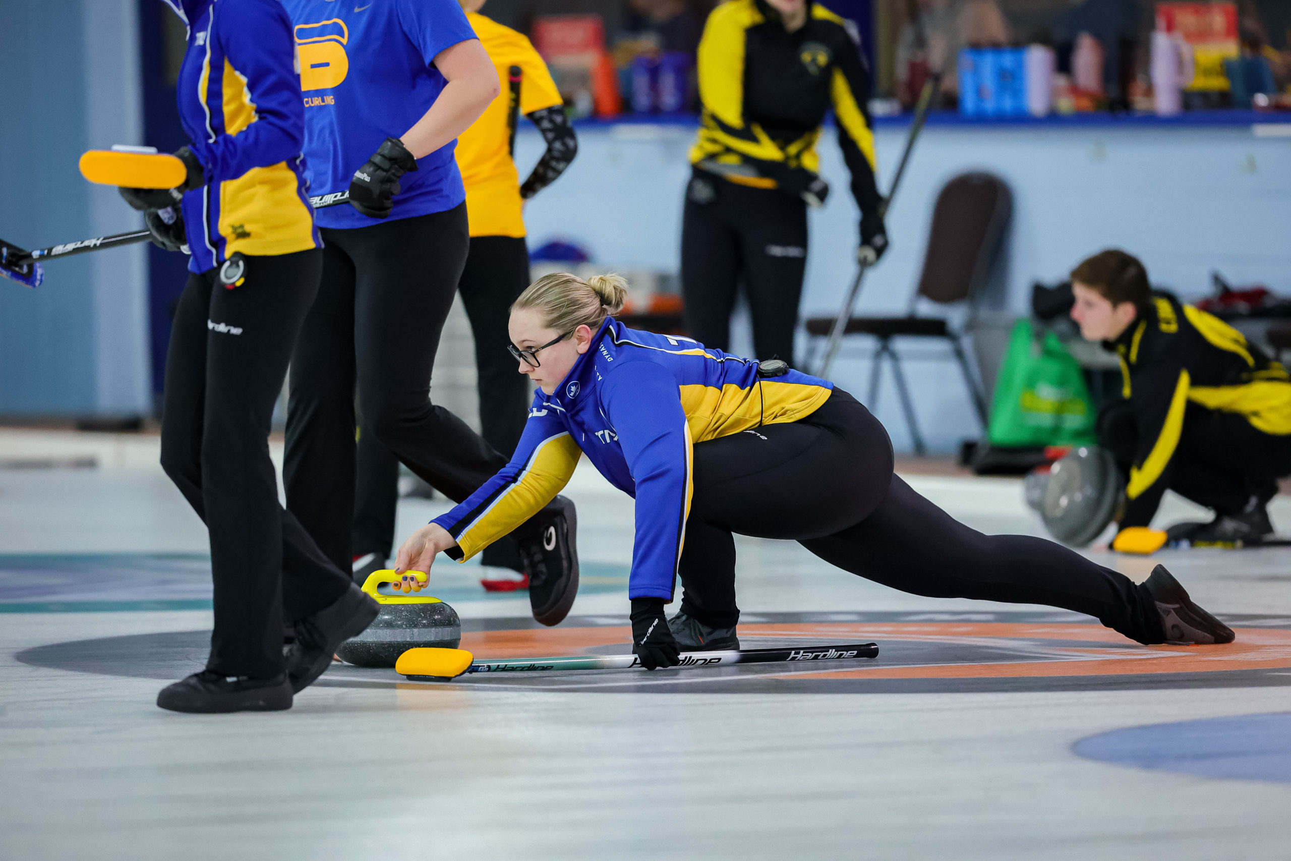 TMU women's curling lead Jessica Filipcic rolls the rock