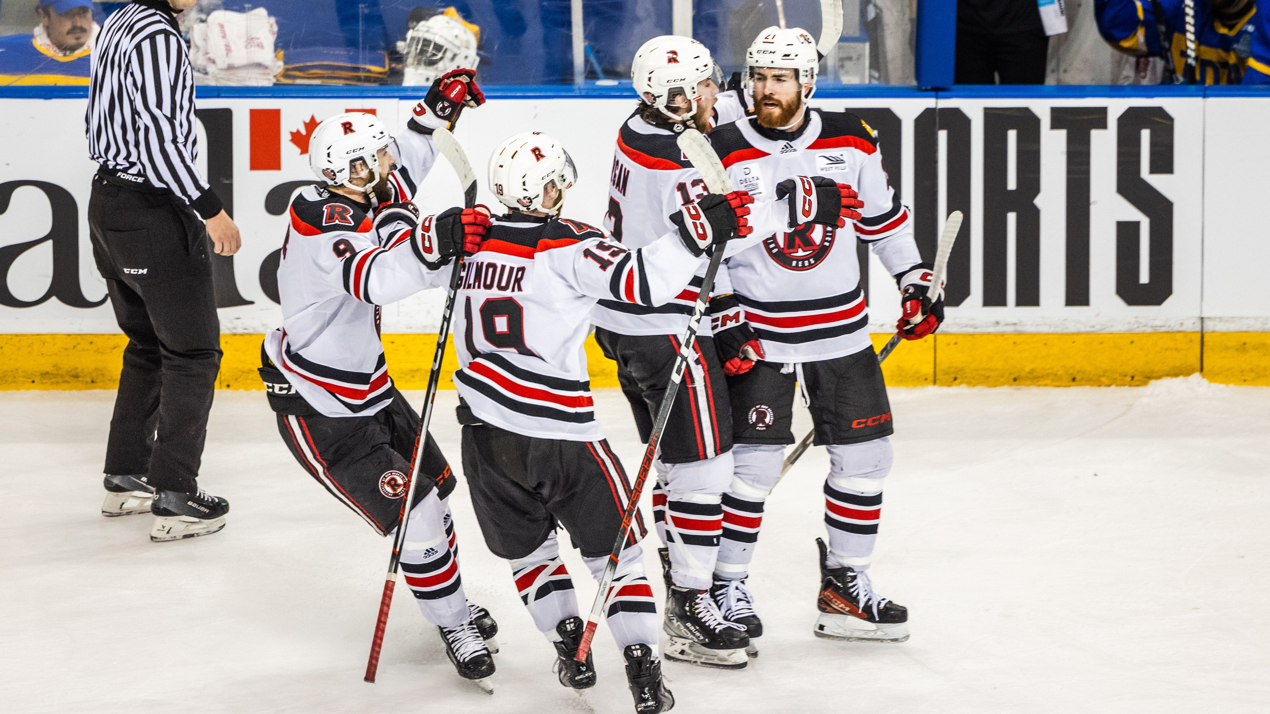 UNB players celebrate on the ice