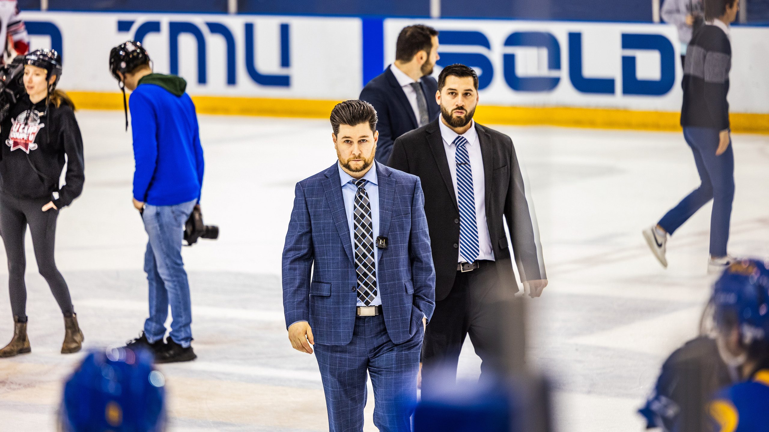 TMU head coach Johnny Duco looks looks somber on the ice post-game