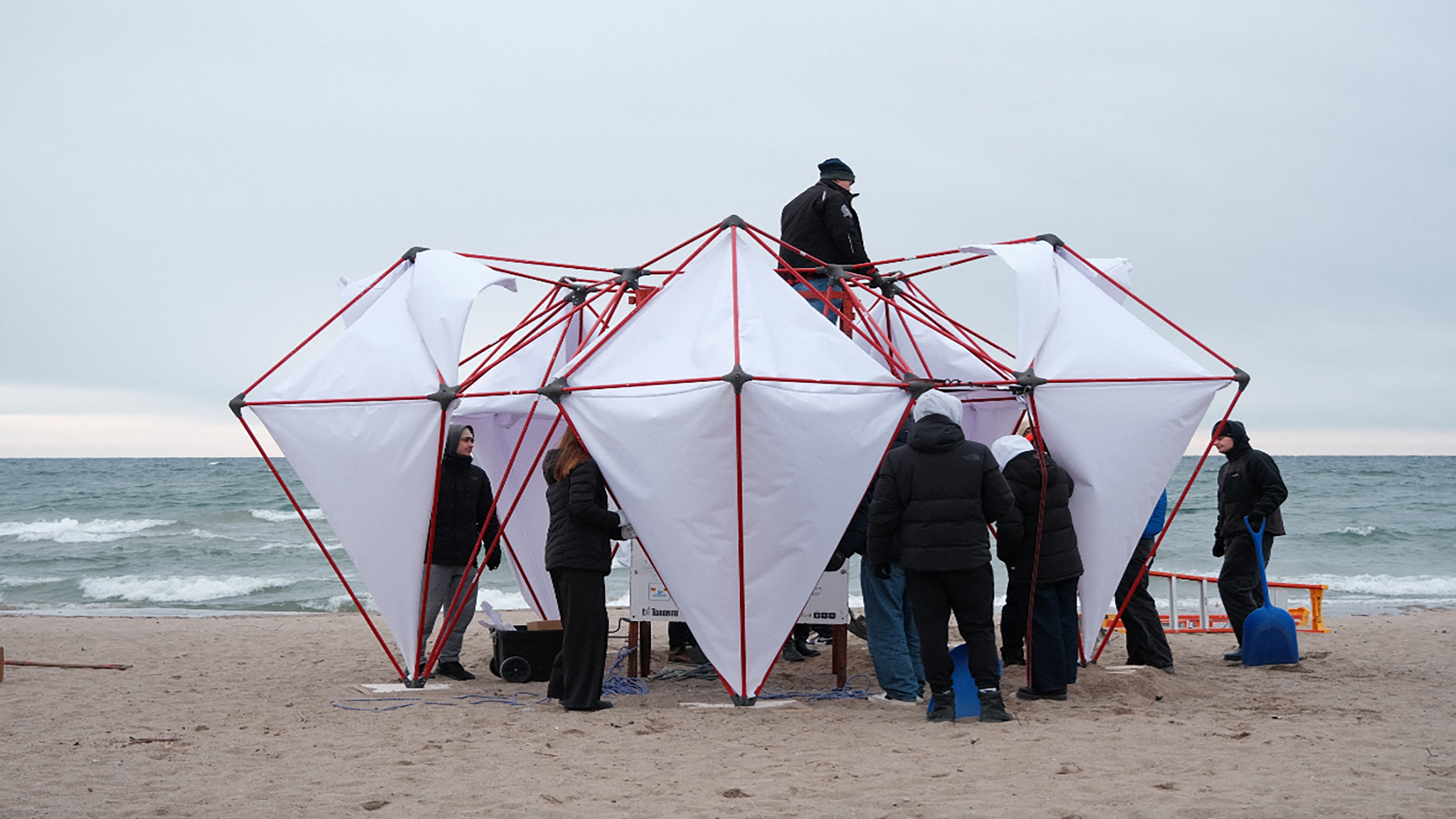 The NOVA team assembles the structure at Woodbine Beach.