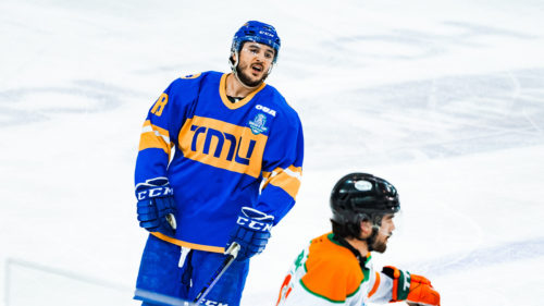 TMU forward Kevin Gursoy talks to a UQTR player