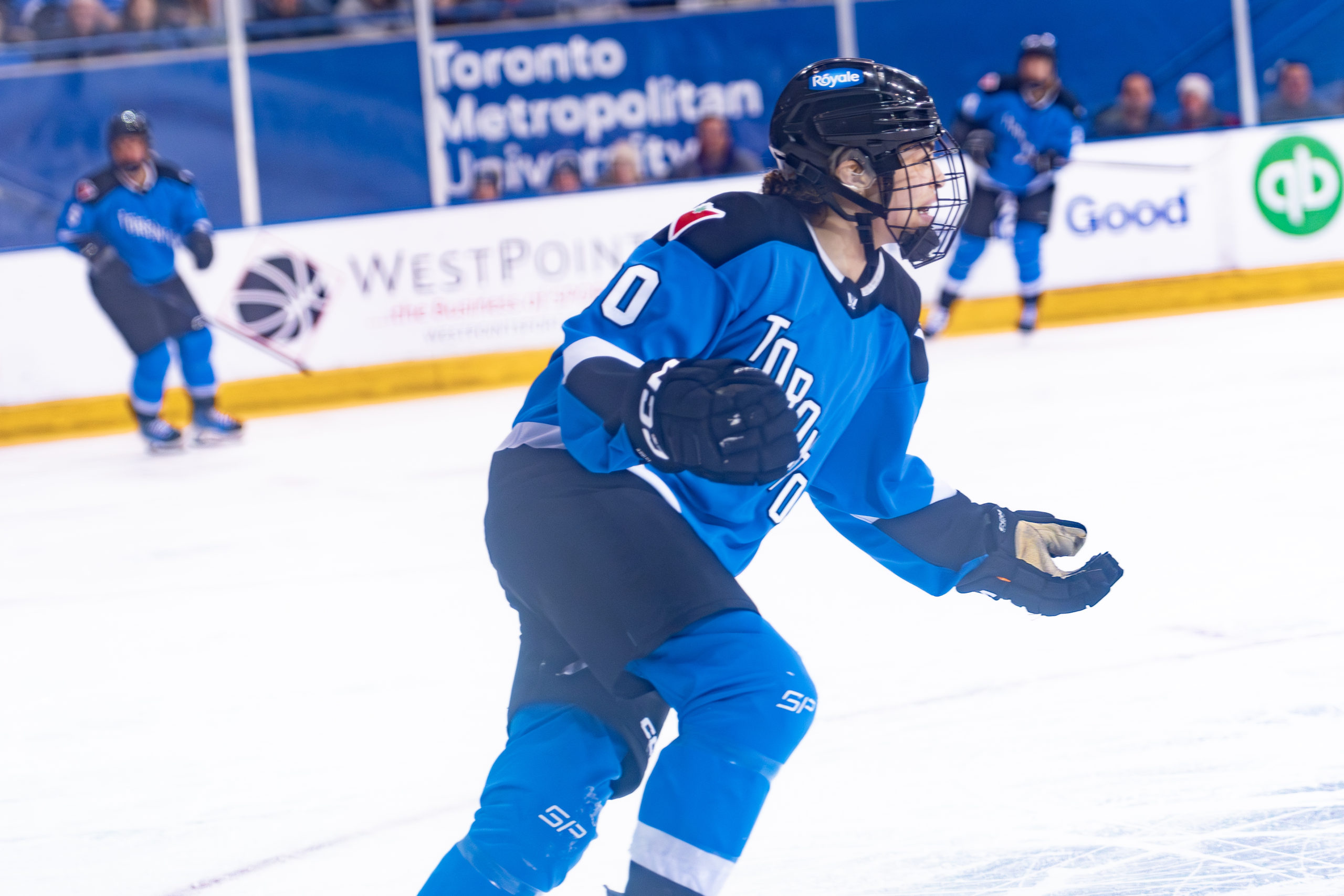 PWHL Toronto player Sarah Nurse skates with hands raised