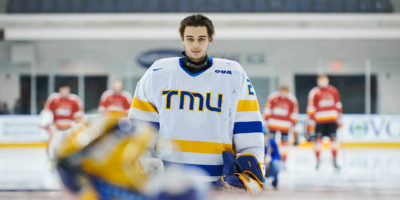 TMU goalie Kai Edmonds stands in front of his post during the national anthem