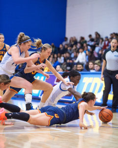 women's basketball players dive for loose ball