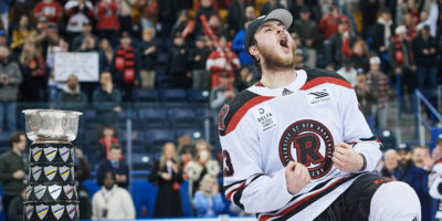 A UNB player celebrates on the ice
