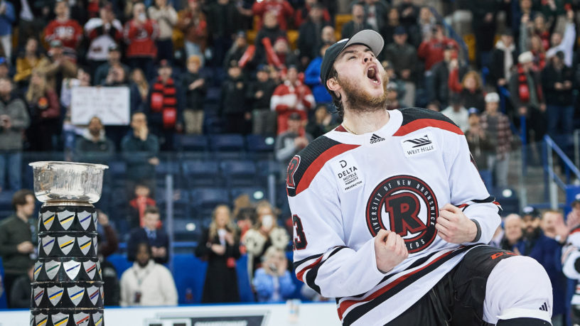 A UNB player celebrates on the ice