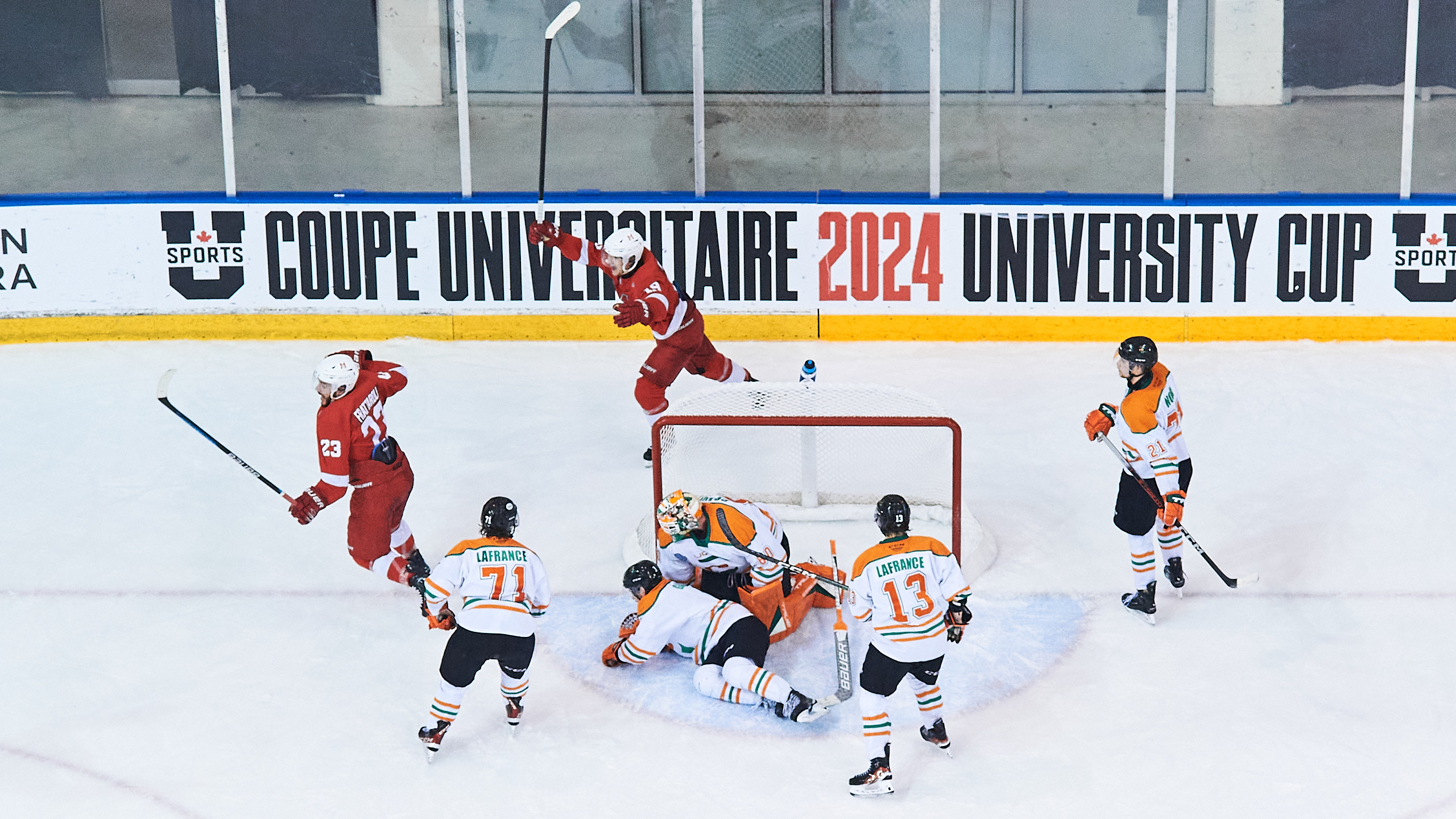 McGill University hockey players celebrate a goal on the ice