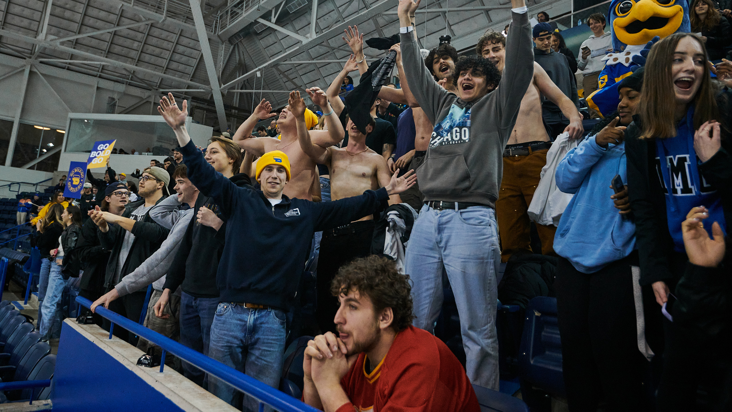 Fans celebrate TMU's win as one Calgary fan sits in shock
