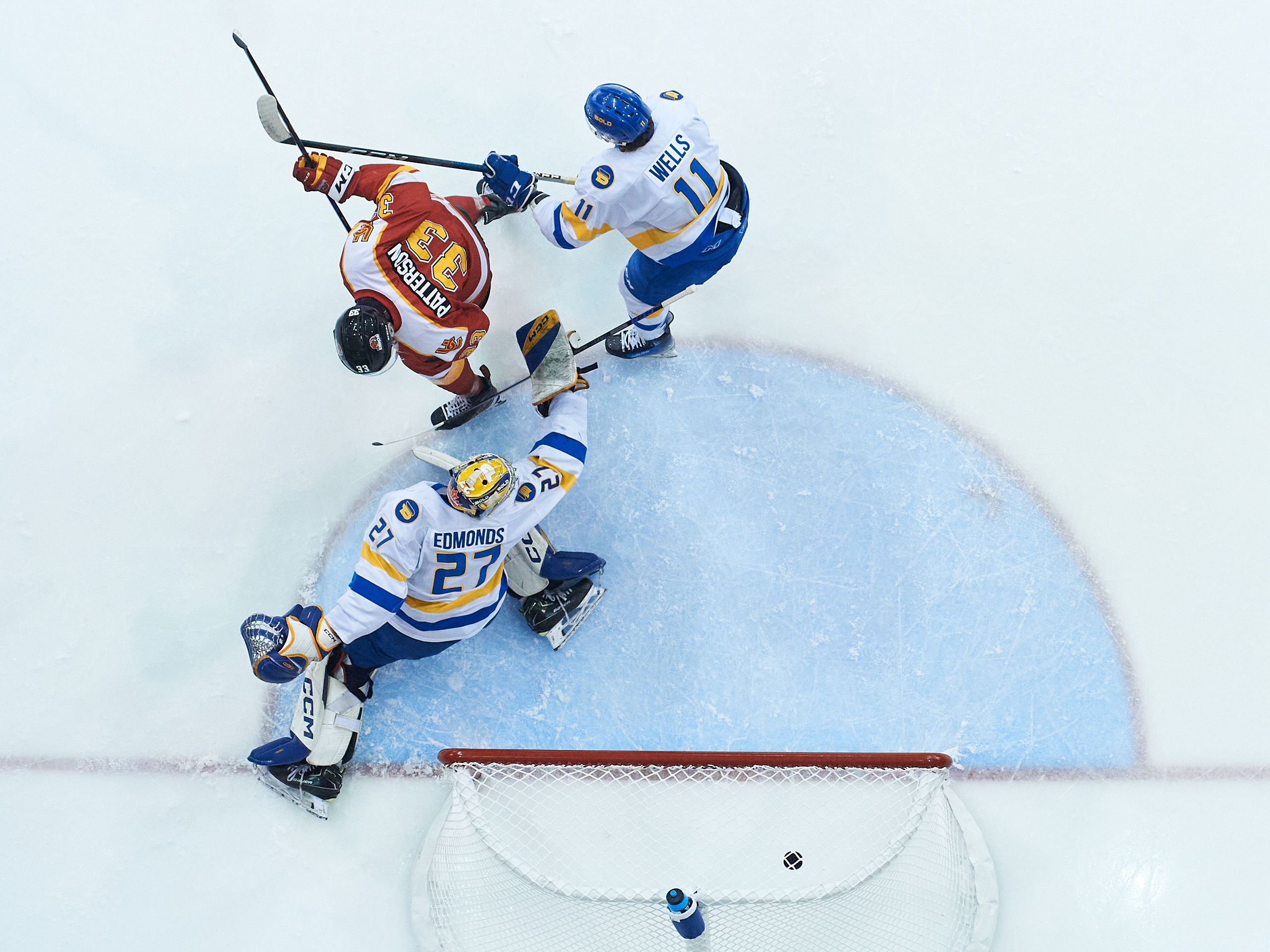 An overhead shot of the puck crossing the TMU goal line