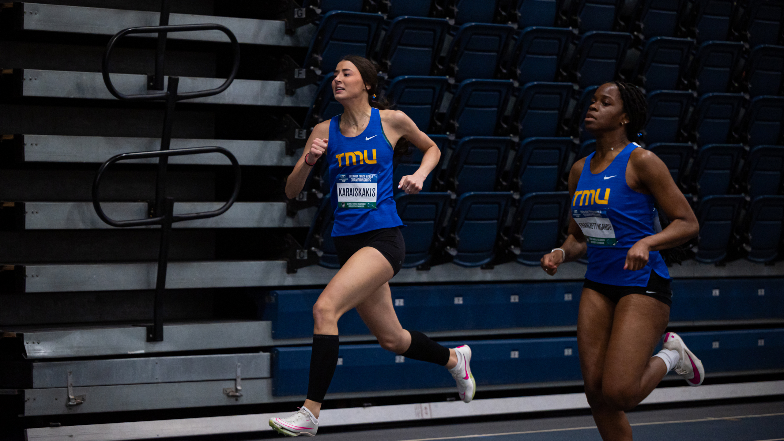 TMU track athlete Christina Karaiskakis runs alongside her teammate