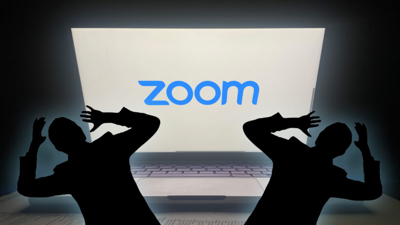 two silhouettes of people scared of a bright screen that has the blue zoom logo