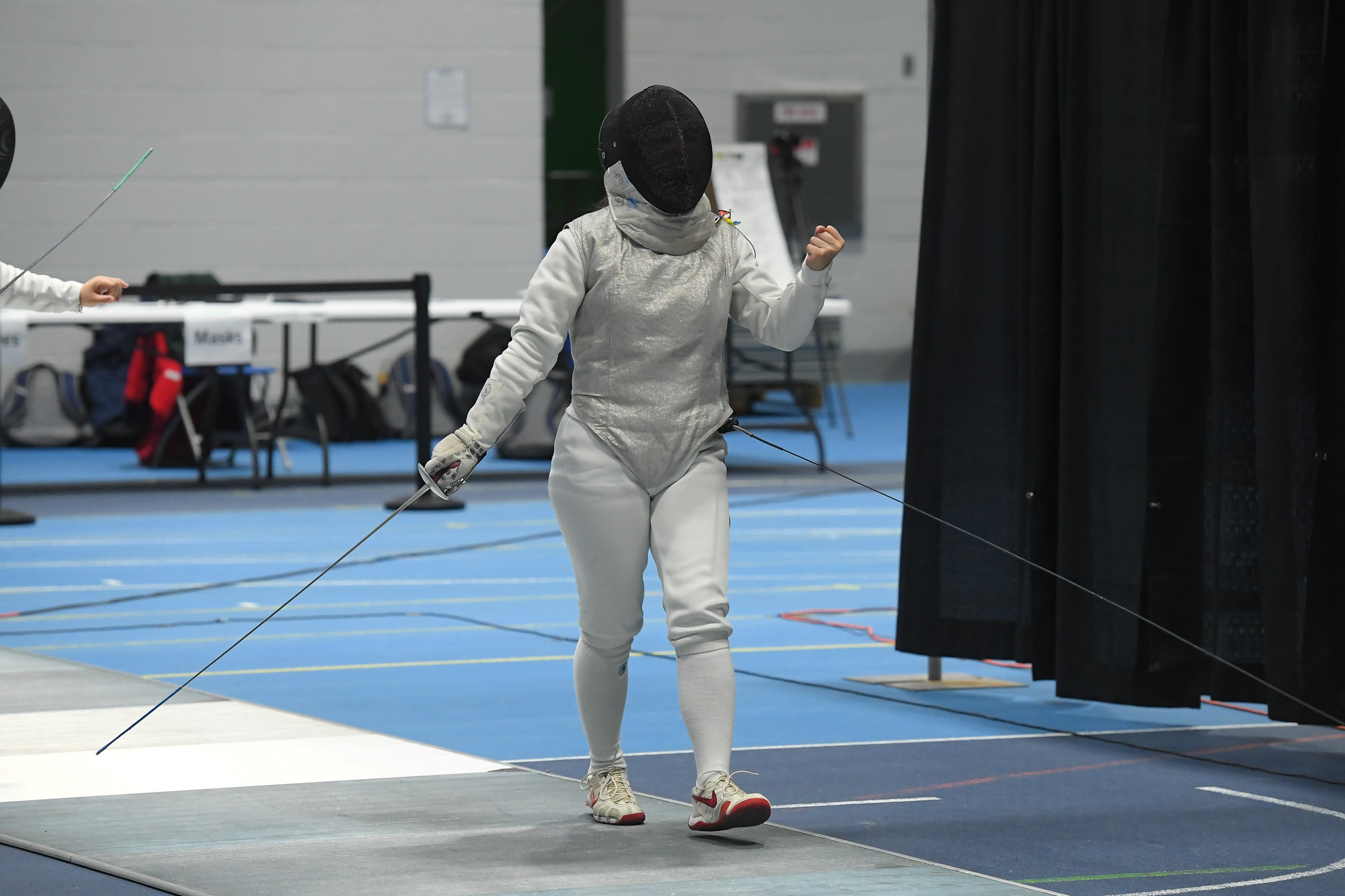 TMU fencer Erika Dominguez punches her fist 