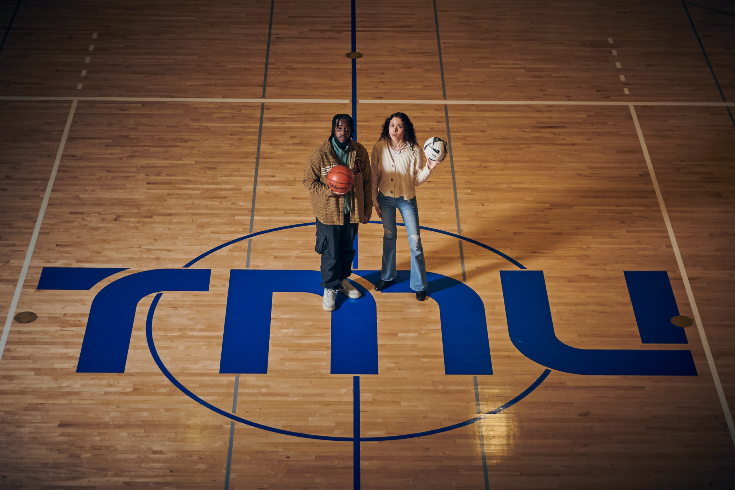 Two people stand at TMU's centre court