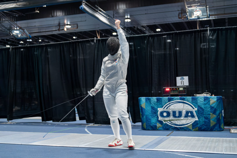 TMU Fencer Erika Dominguez holds fist in the air