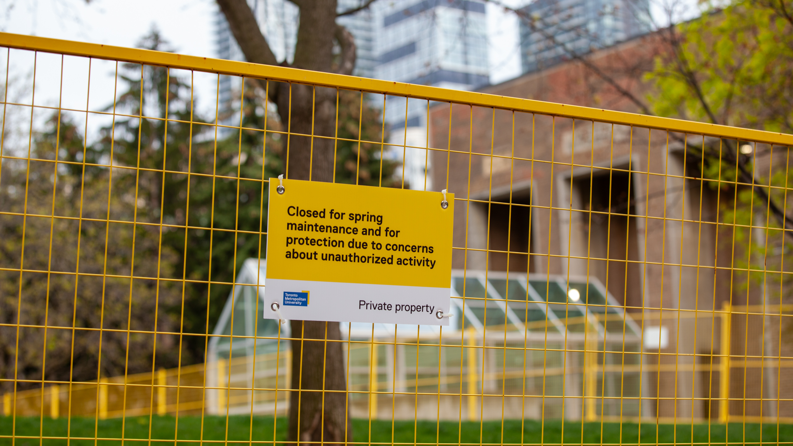 A sign which reads "Closed for spring maintenance and for protection due to concerns about unauthorized activity" put on the fences restricting access to the Kerr Quad