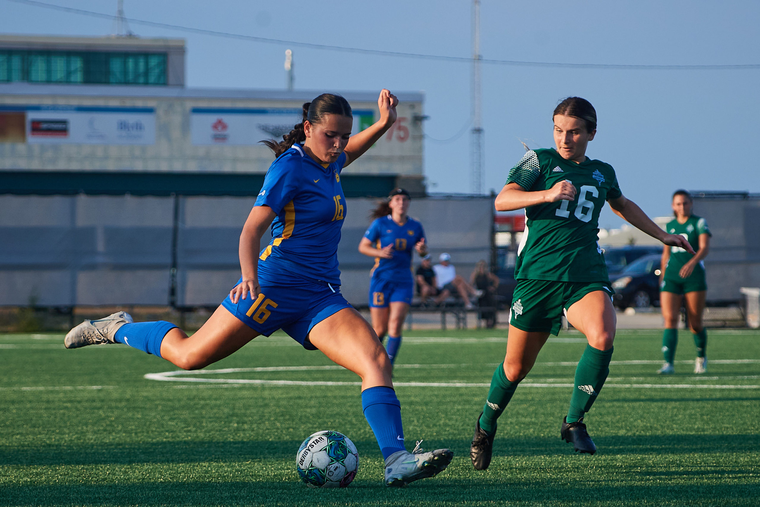 first-year defender Reilley Flesher crossing the ball