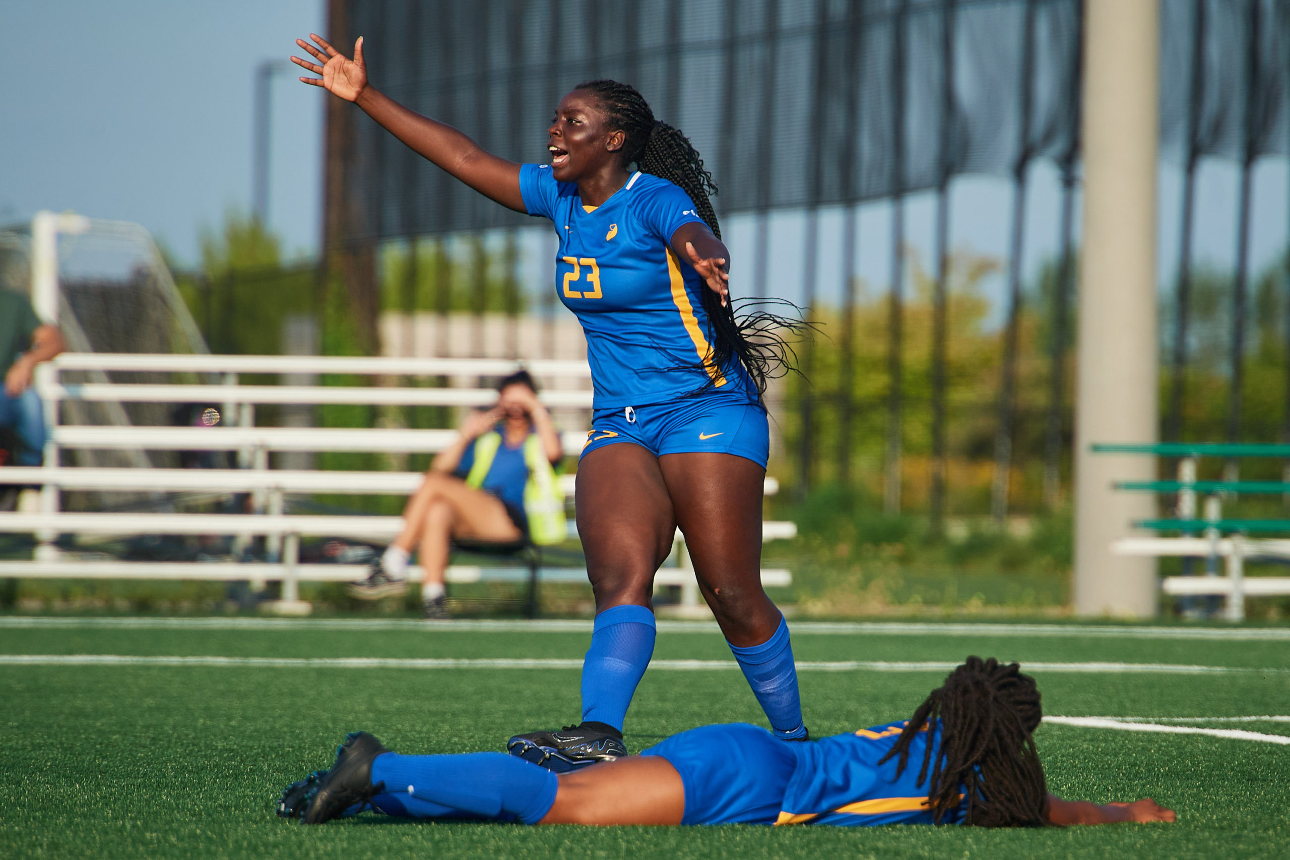 Third year forward Aalayah Lulli screaming to the referee claiming a foul on second-year forward Kennedy Pryce