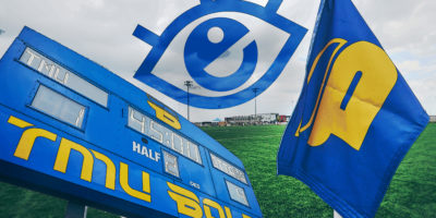 a composition of the tmu Bold with the scoreboard of the soccer team