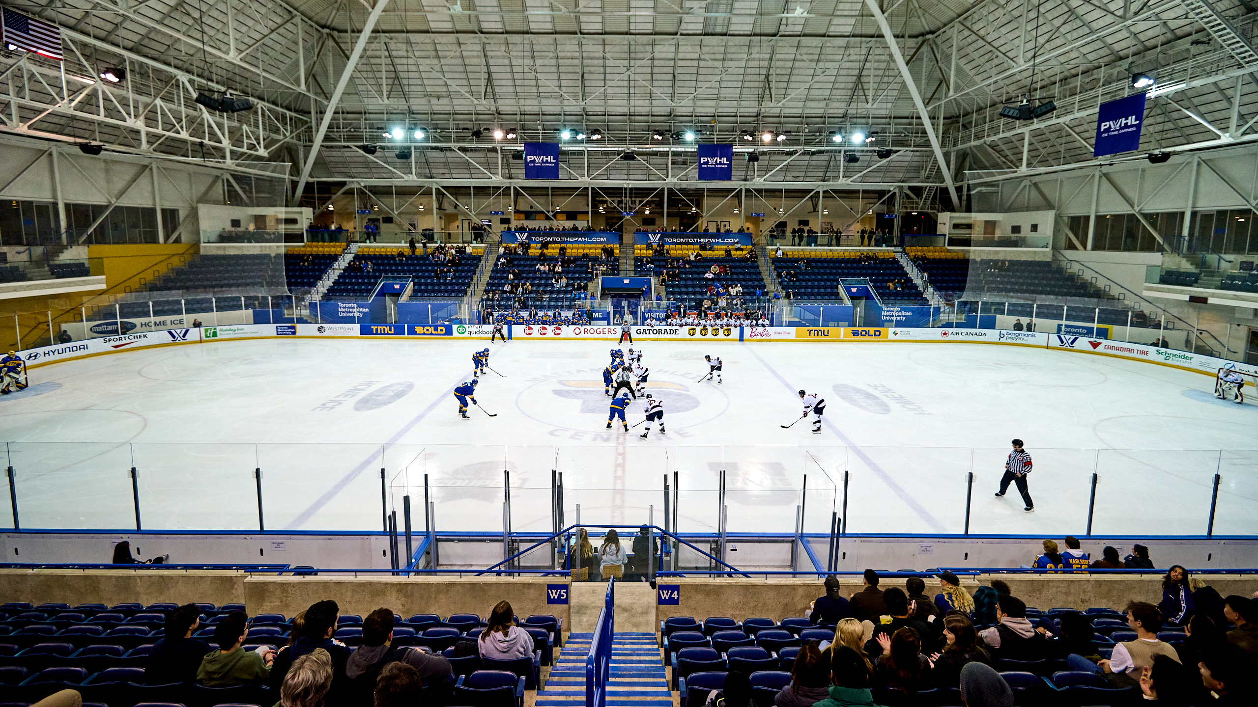 A wide image of a university hockey game