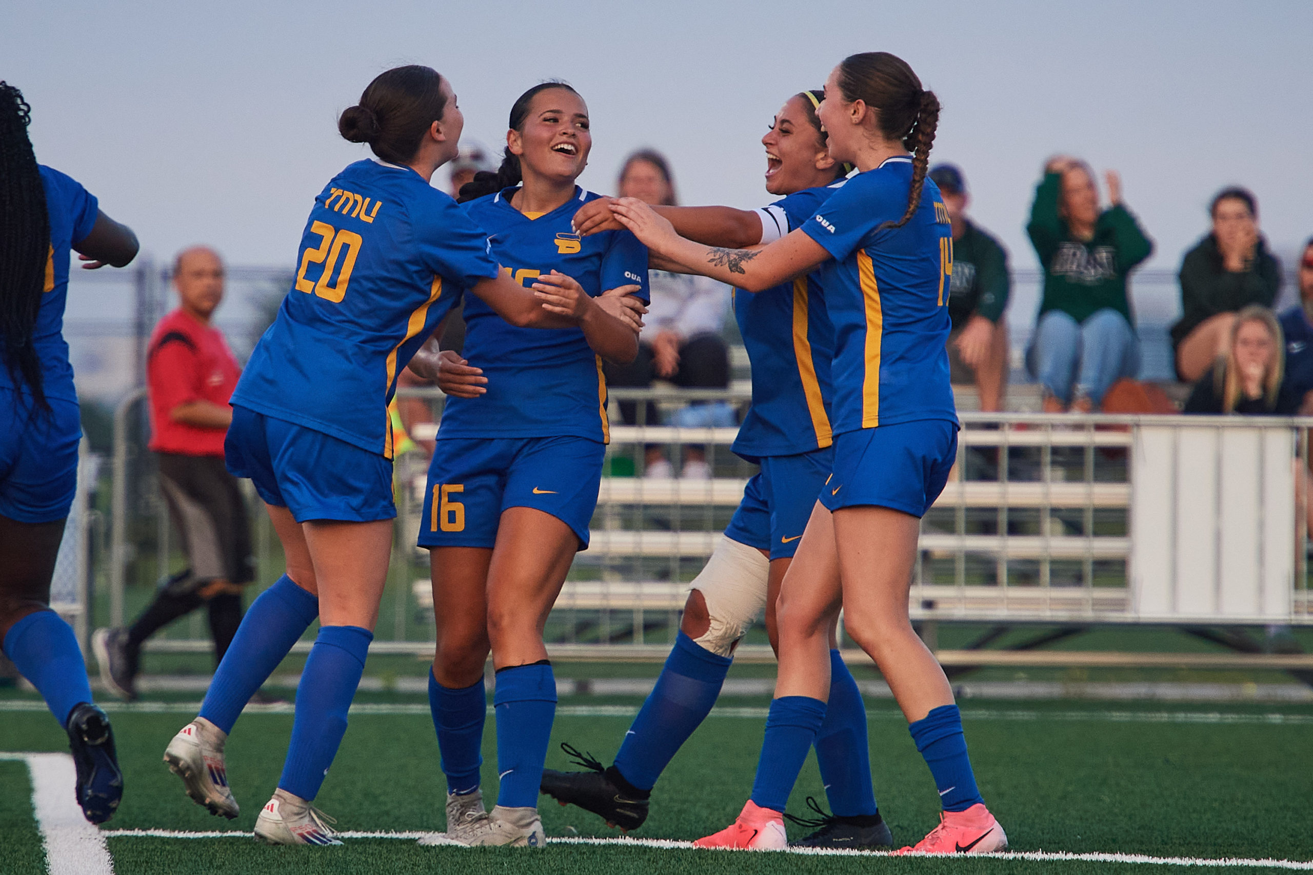 the TMU Bold women's team celebrating defender Reilly Flesher's first goal in her debut with the team