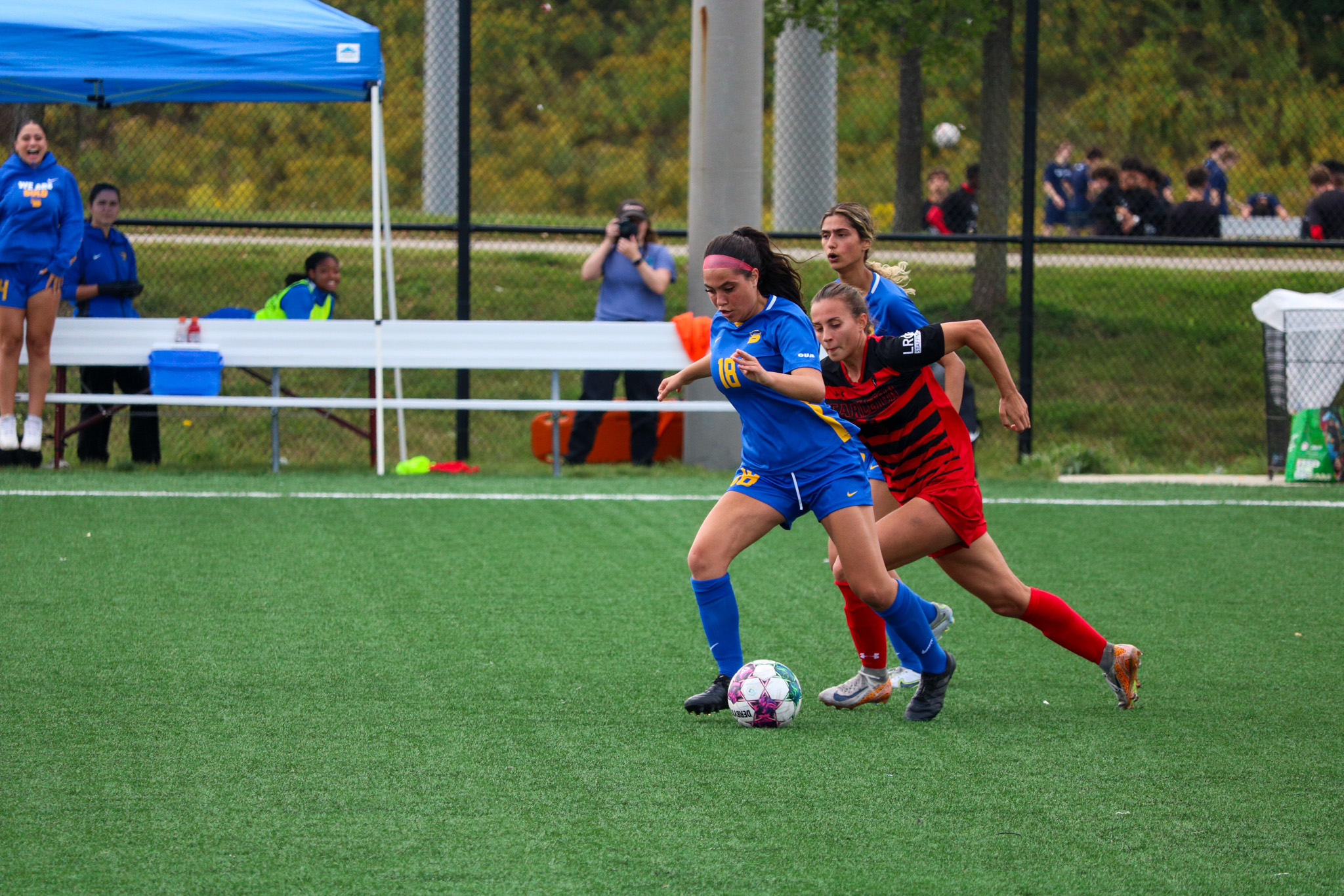 Lisamarie Arangio carrying the ball with her feet