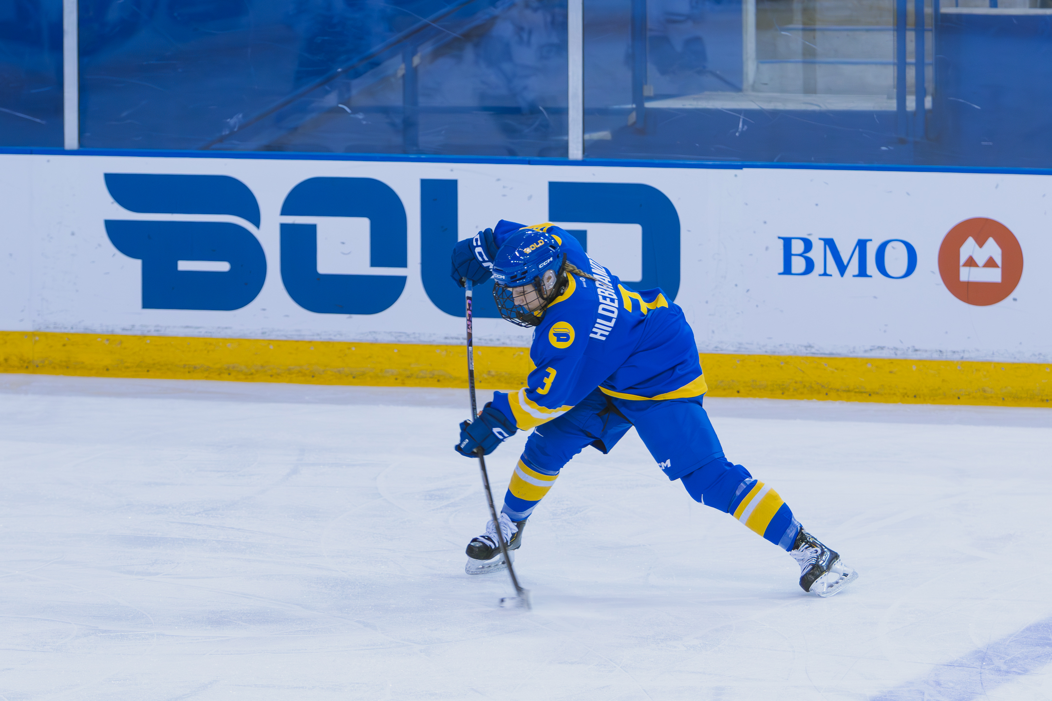 first-year defender Taliya Hildebrandt shooting a wrist shot 