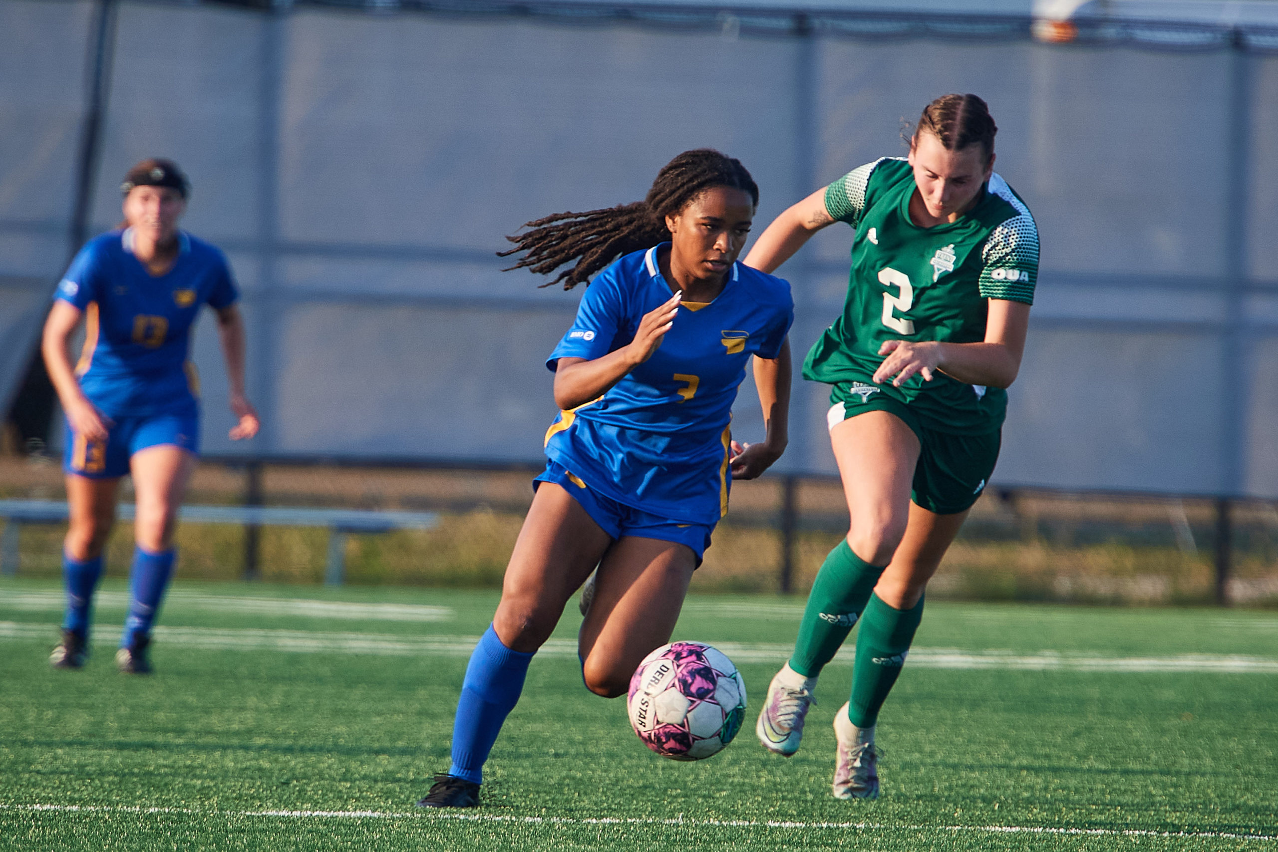 winger Kennedy Pryce sprinting with the ball in her feet