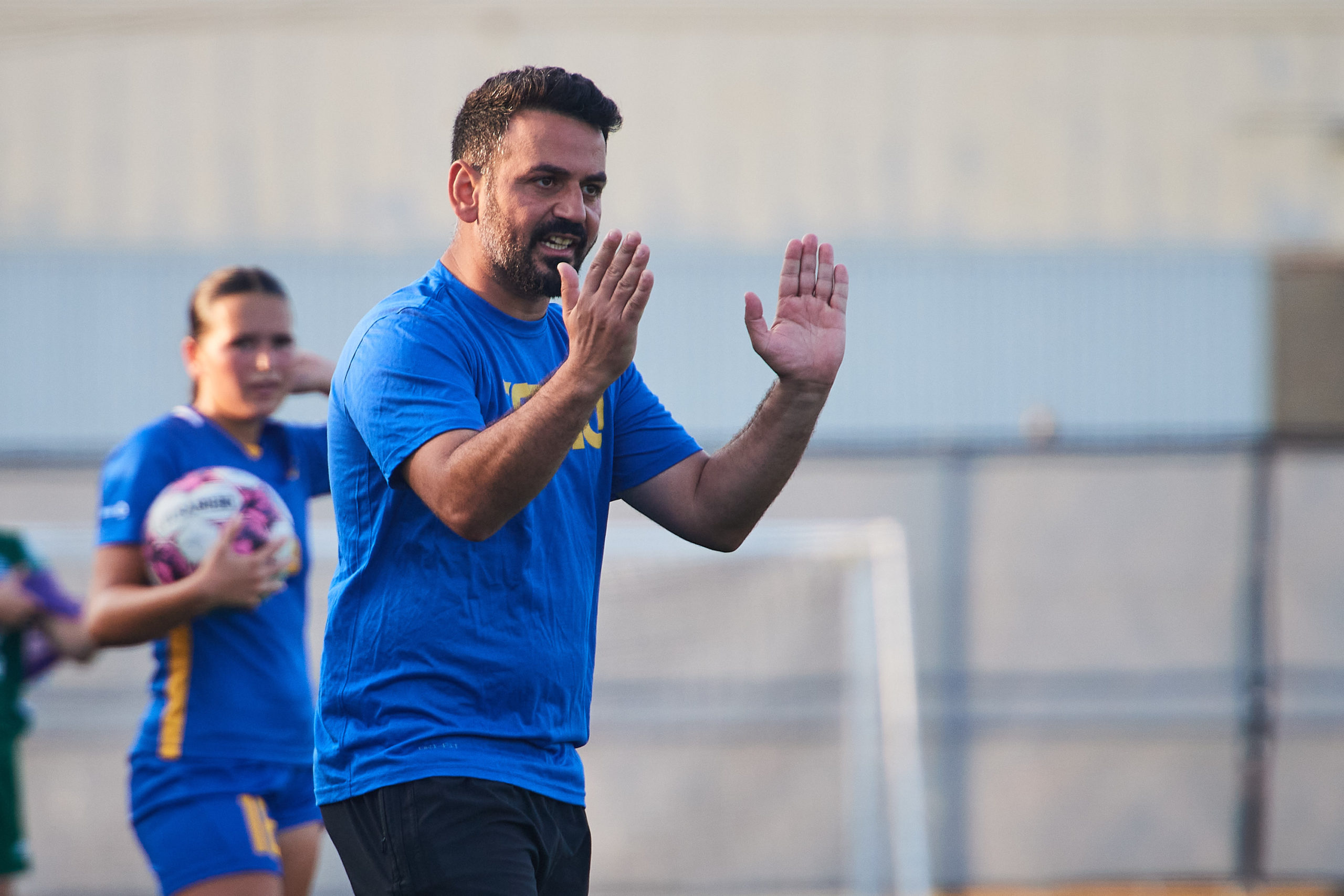 assistant coach John Yacou giving instructions to the team