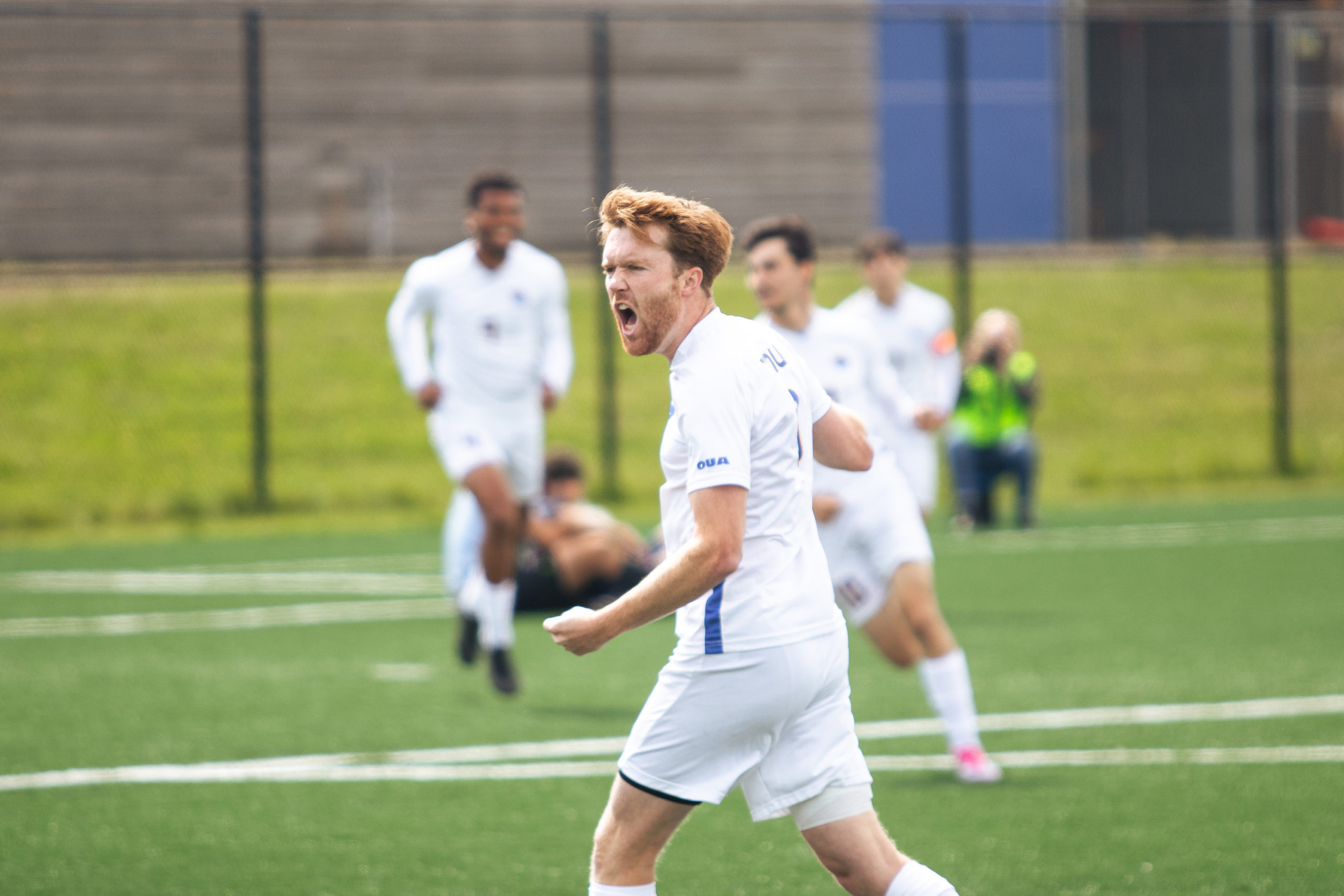 Colin Gander celebrating a goal from the TMU Bold men's soccer team