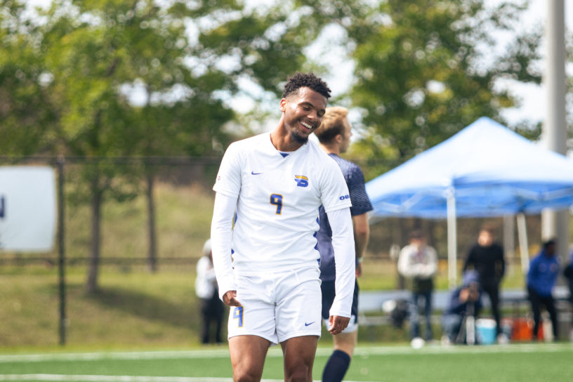 Jevontae Layne smiling after debuting for the TMU Bold men's soccer team