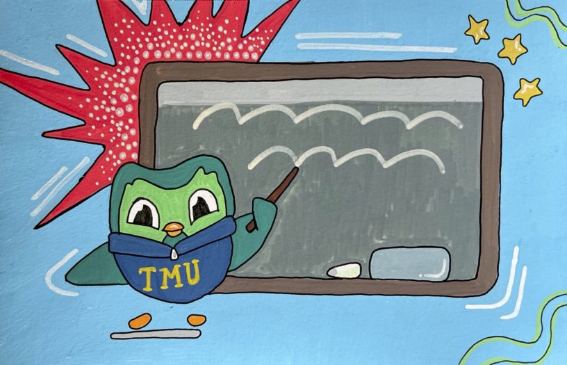 An illustration of Duo the Duolingo mascot wearing a blue TMU sweater pointing a stick towards a grey chalkboard.