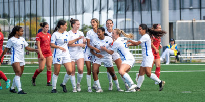 The TMU Bold women's soccer team celebrating Taliyah's Walker goal