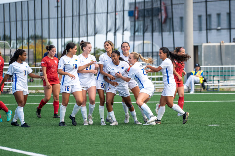 The TMU Bold women's soccer team celebrating Taliyah's Walker goal