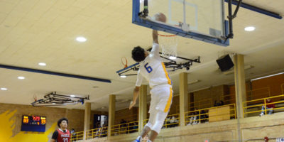 Landon Wright throws down a dunk against the McGill Redbirds