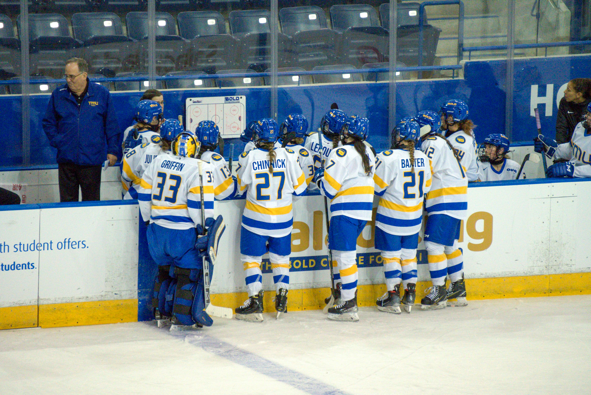 The TMU Bold women's hockey talking with head coach Lisa Haley 