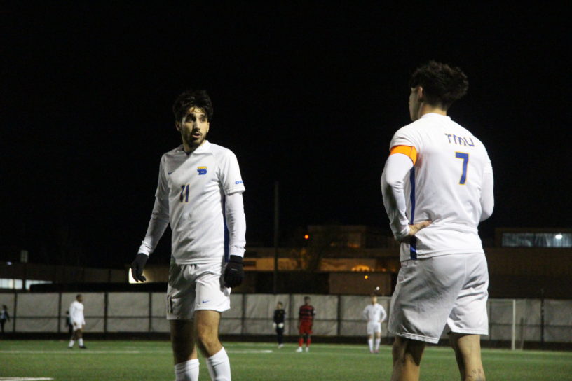 Justin Santos and Luca Di Marco speak during a game