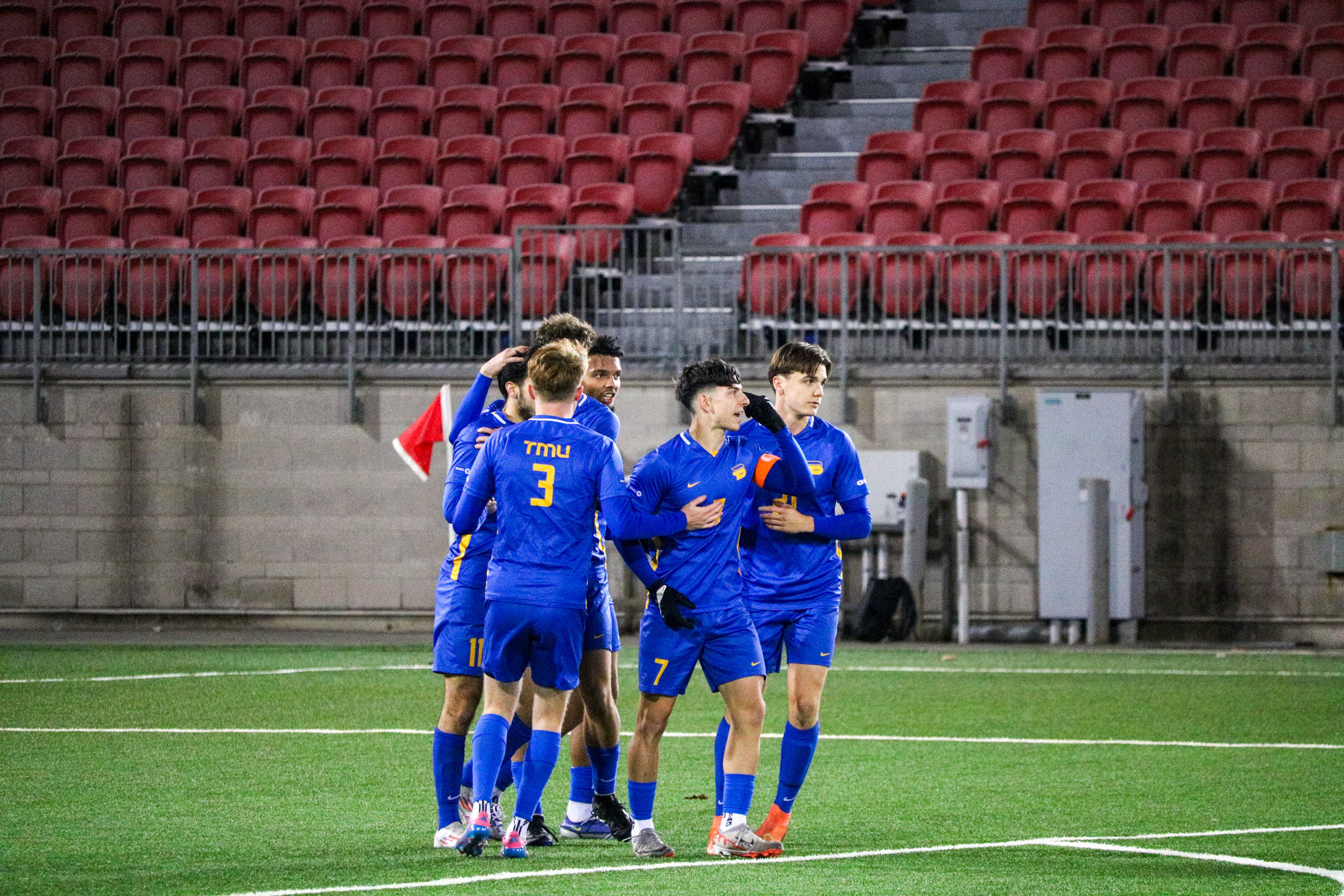 Luca Di Marco celebrating his goal with some other teammates