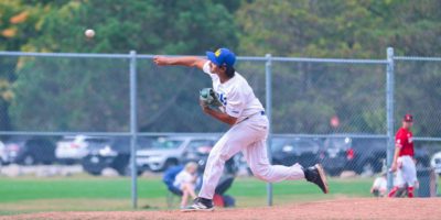 Santiago Rincon pitching a ball with the baseball team