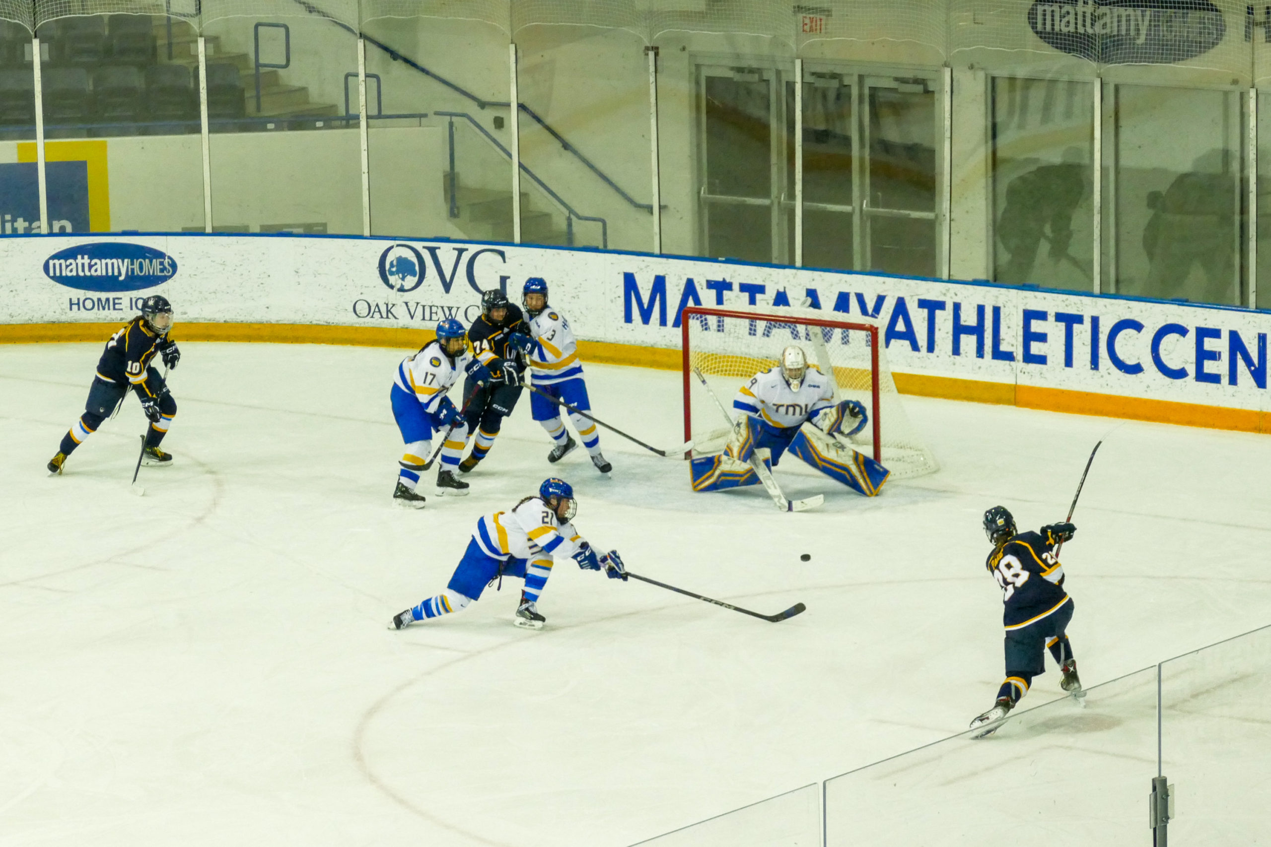 A Windsor player shooting towards the net