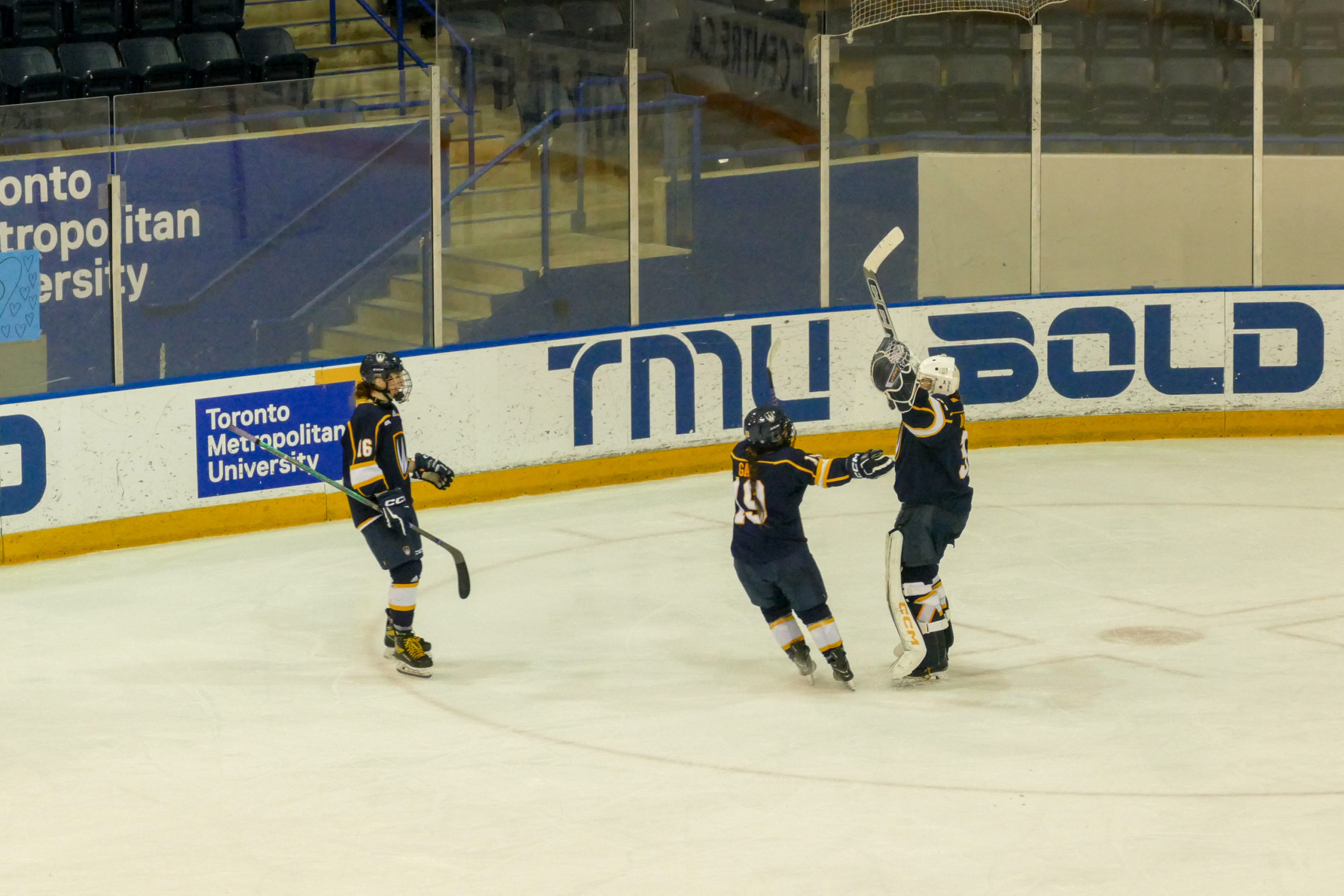 Three Windsor players celebrating the win