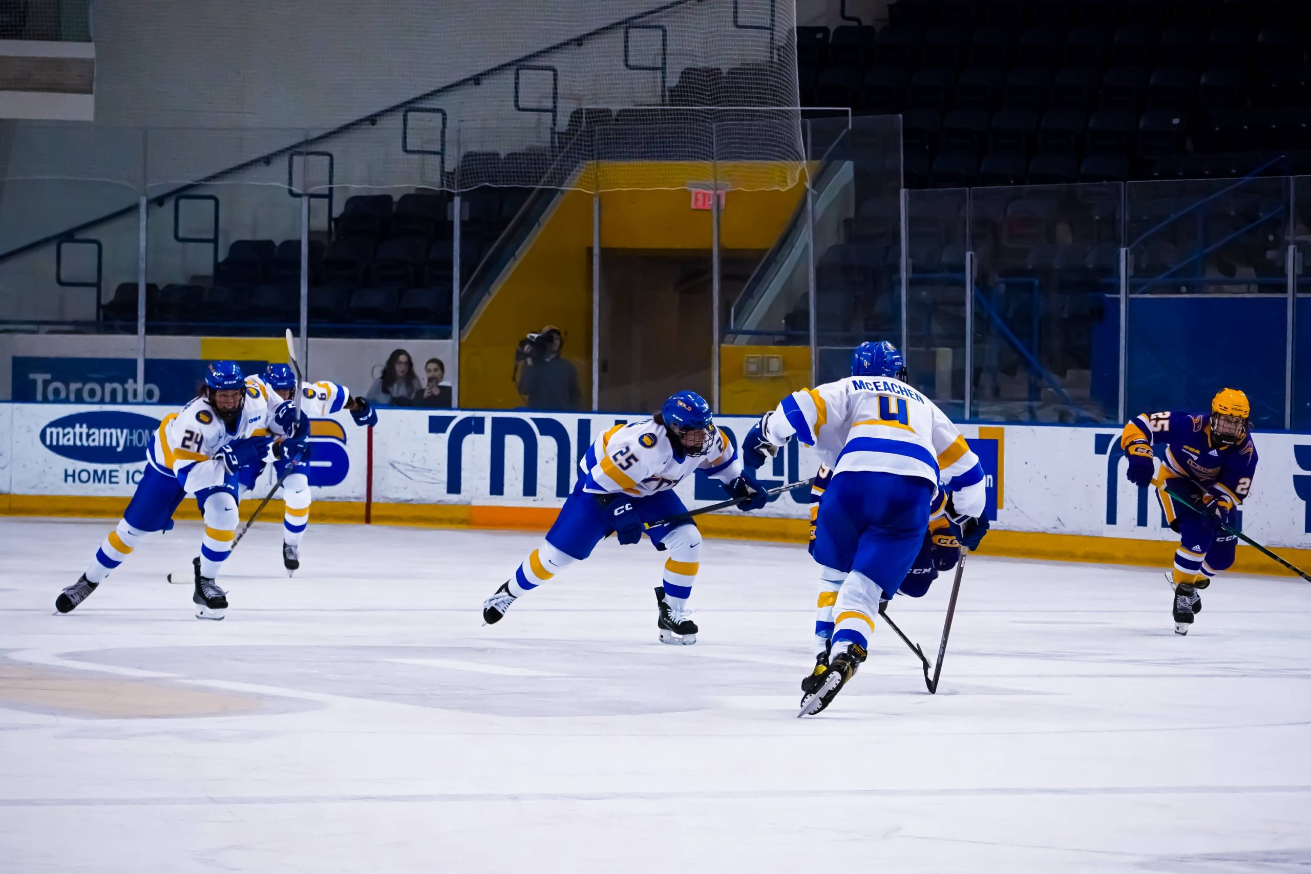 A couple of TMU Bold players skating