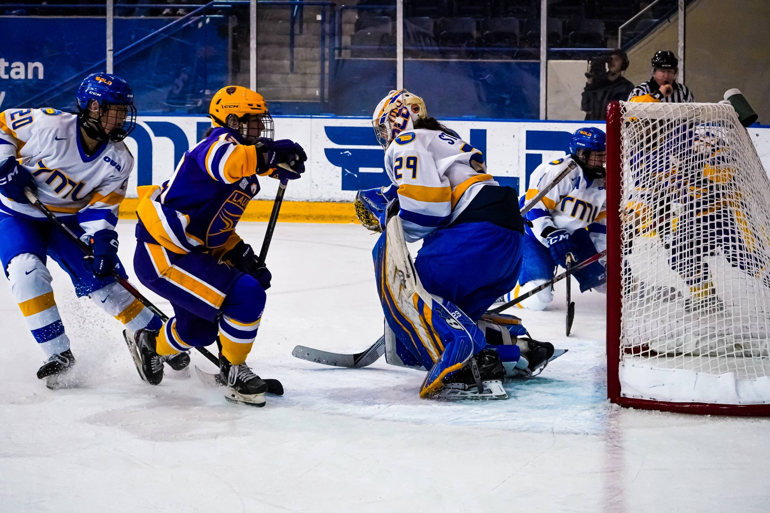 Alexia Stratos in goal trying to stop the puck