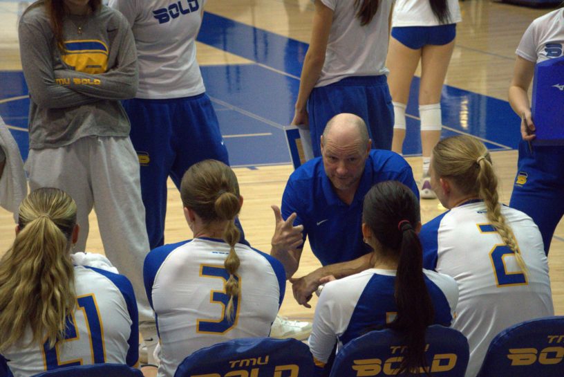 Dustin Reid giving instructions to his players