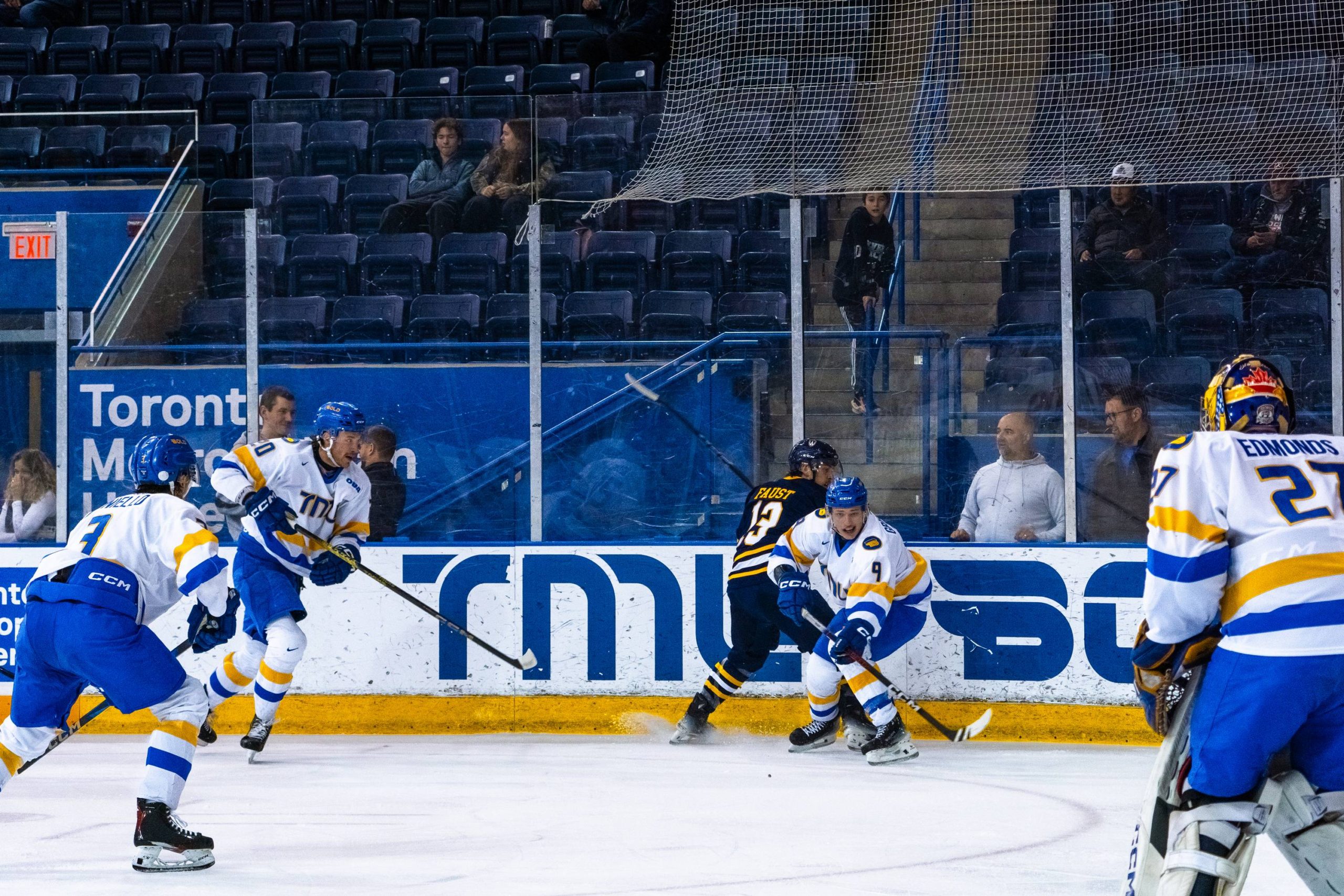 The TMU Bold battling for the puck