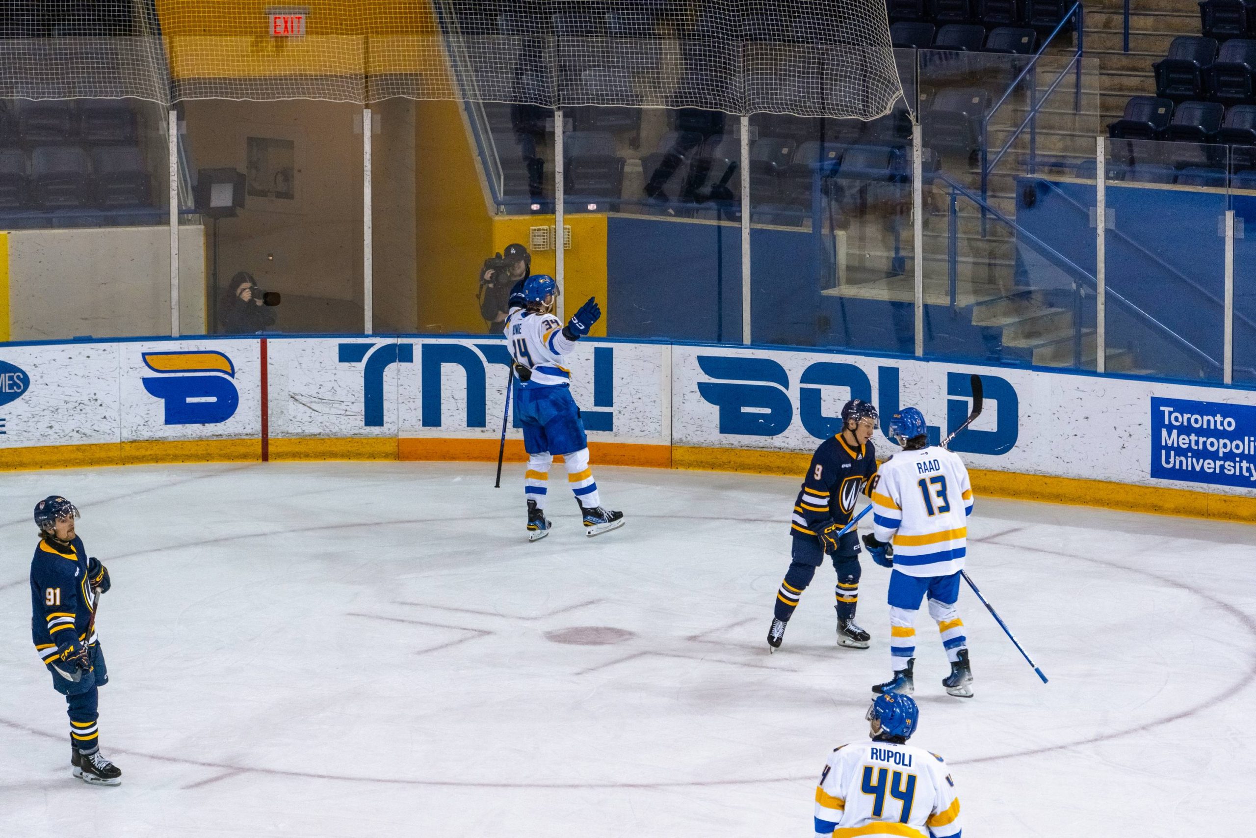 Connor Bowie celebrating the second goal of the night near the boards