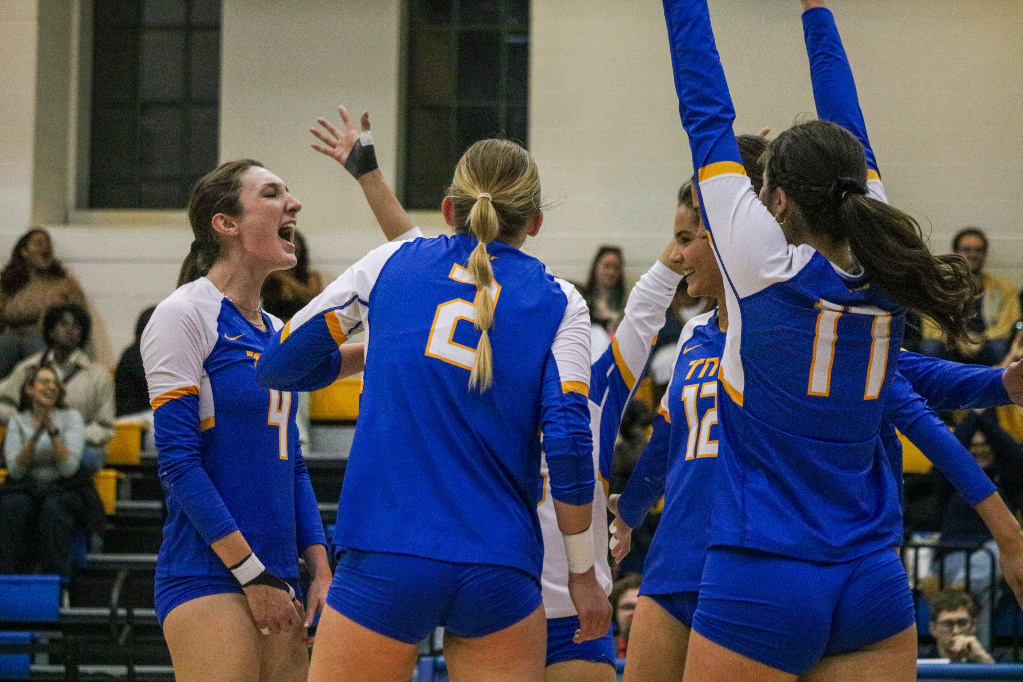 the team celebrating a point from Hannah Bellai